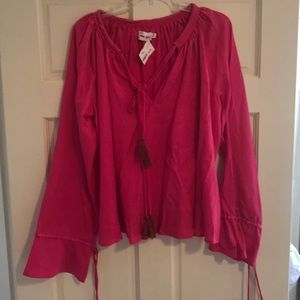 Pink top, runs large